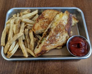 The grilled cheese and perfectly seasoned fries from Frunchroom. Raclette cheese, pickles, and french onion. Delicious!